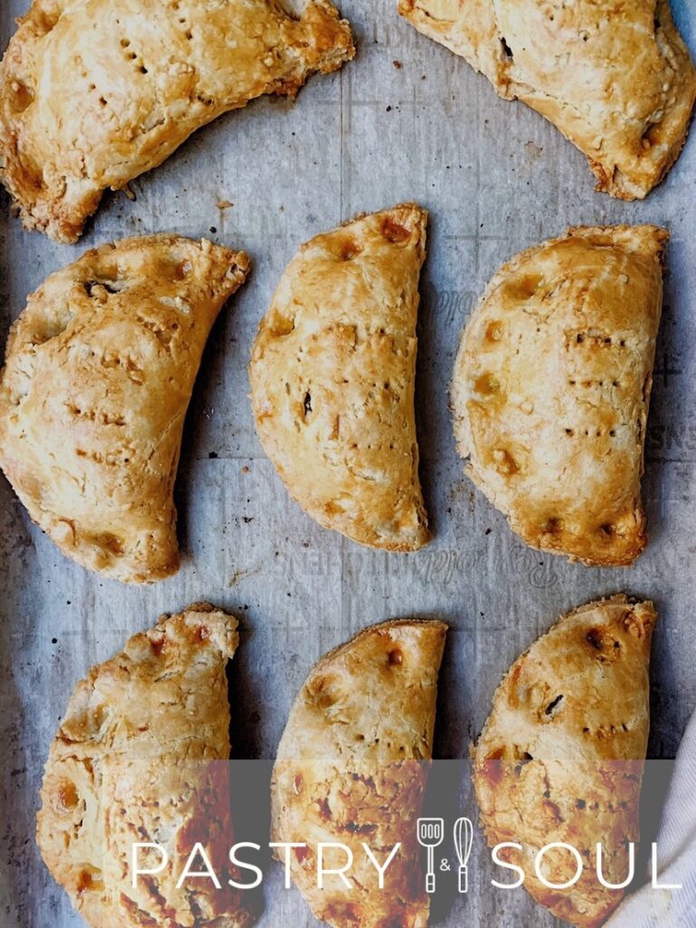 Ghanaian Meat pies on parchment paper