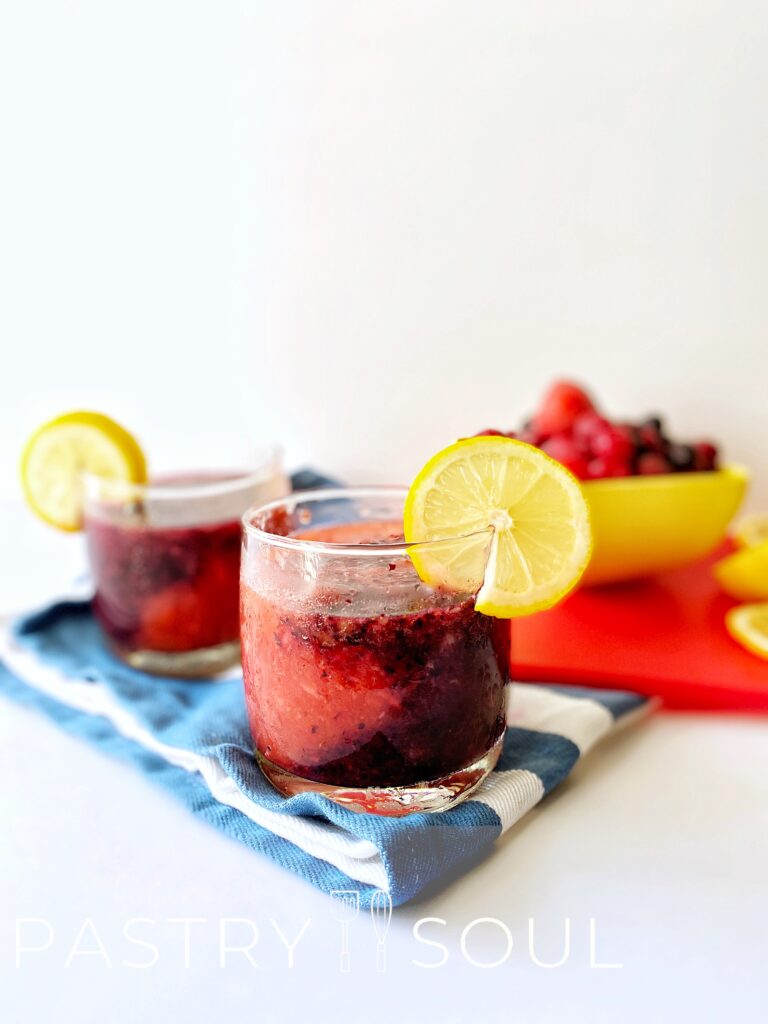 Drink in a glass cup on a blue dish towel