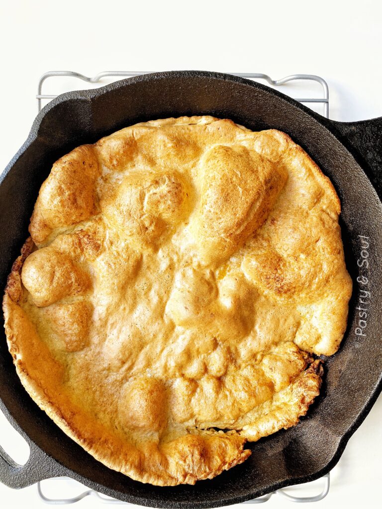 plain dutch baby in a cast iron skillet