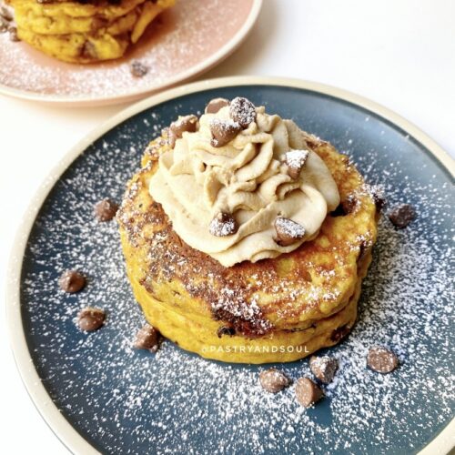 pumpkin pancakes on blue and pink plates