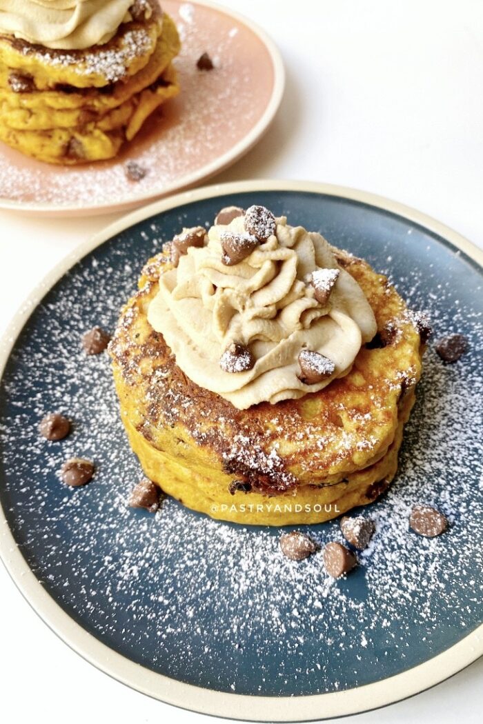 pumpkin pancakes on blue and pink plates