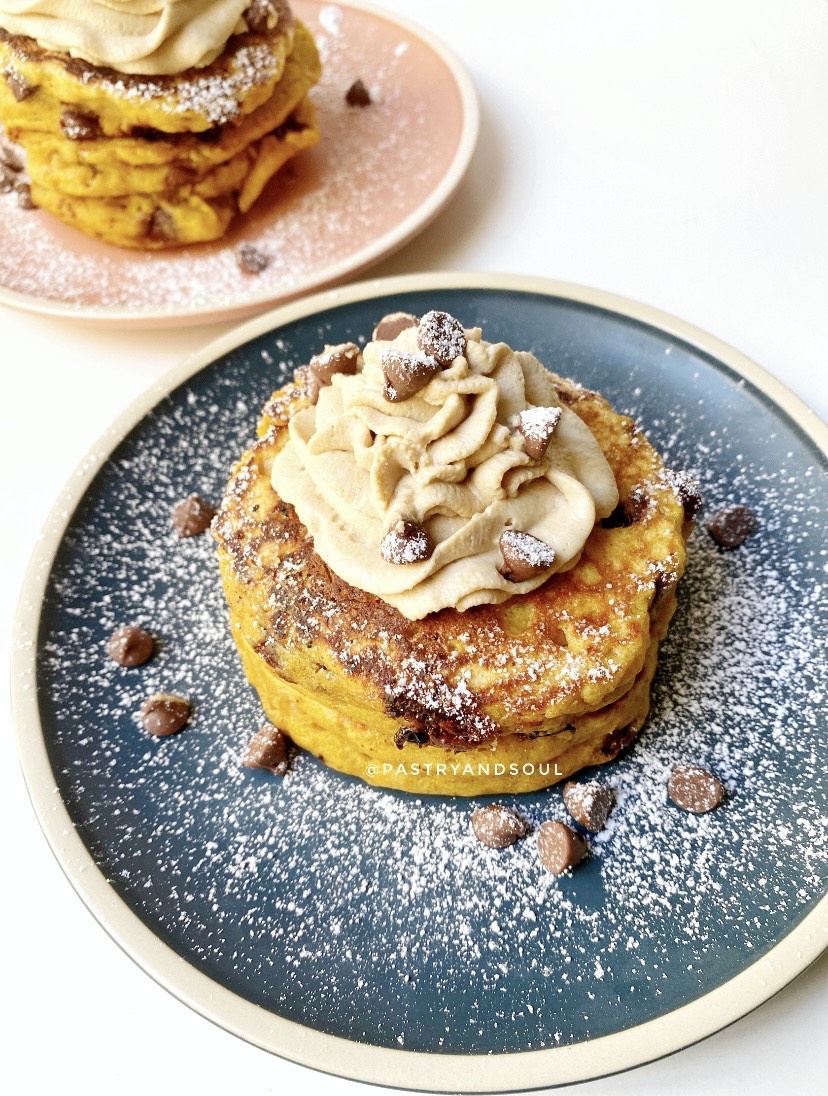 pumpkin pancakes on blue and pink plates